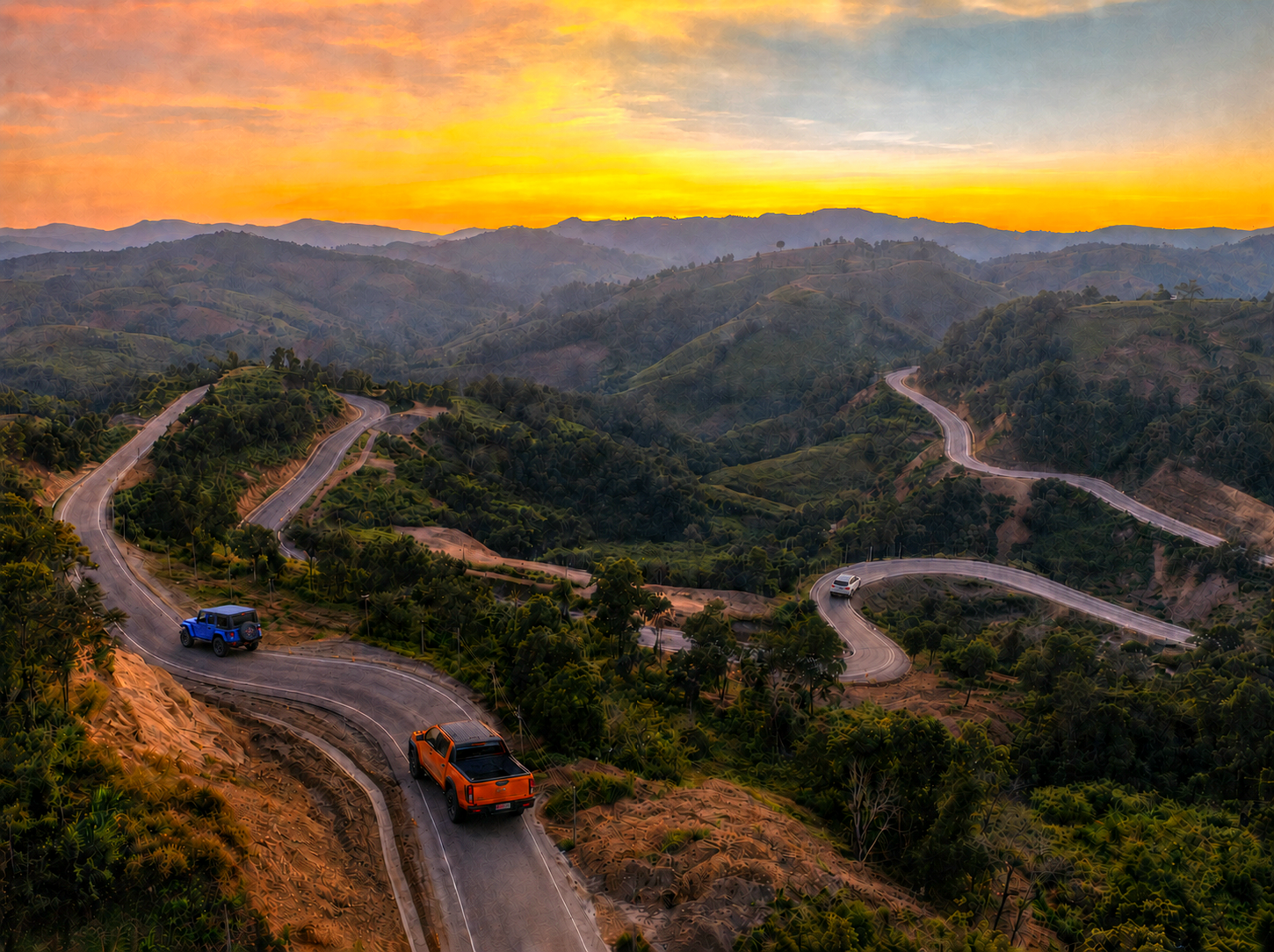 A winding mountain road at sunset — from city streets to mountain peaks.
